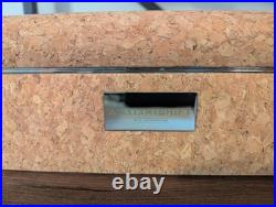 Analog/Shift 1976 Collection 8 Piece Watch Box features cork, steel trimming, an